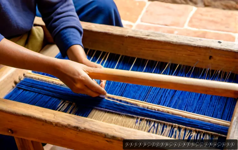 수공예 기법 - Photorealistic close-up of an artisan in Oaxaca, Mexico, weaving a vibrant wool textile on a traditi...